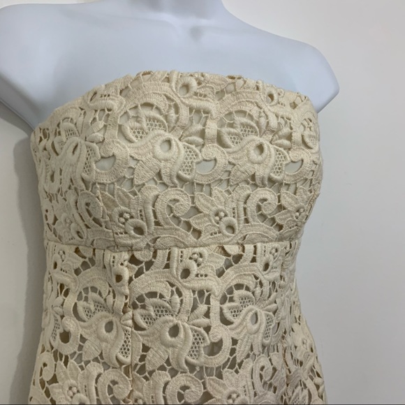 Ivory lace dress by Michael Kors is in like new condition. Size 2 - Picture 7 of 16